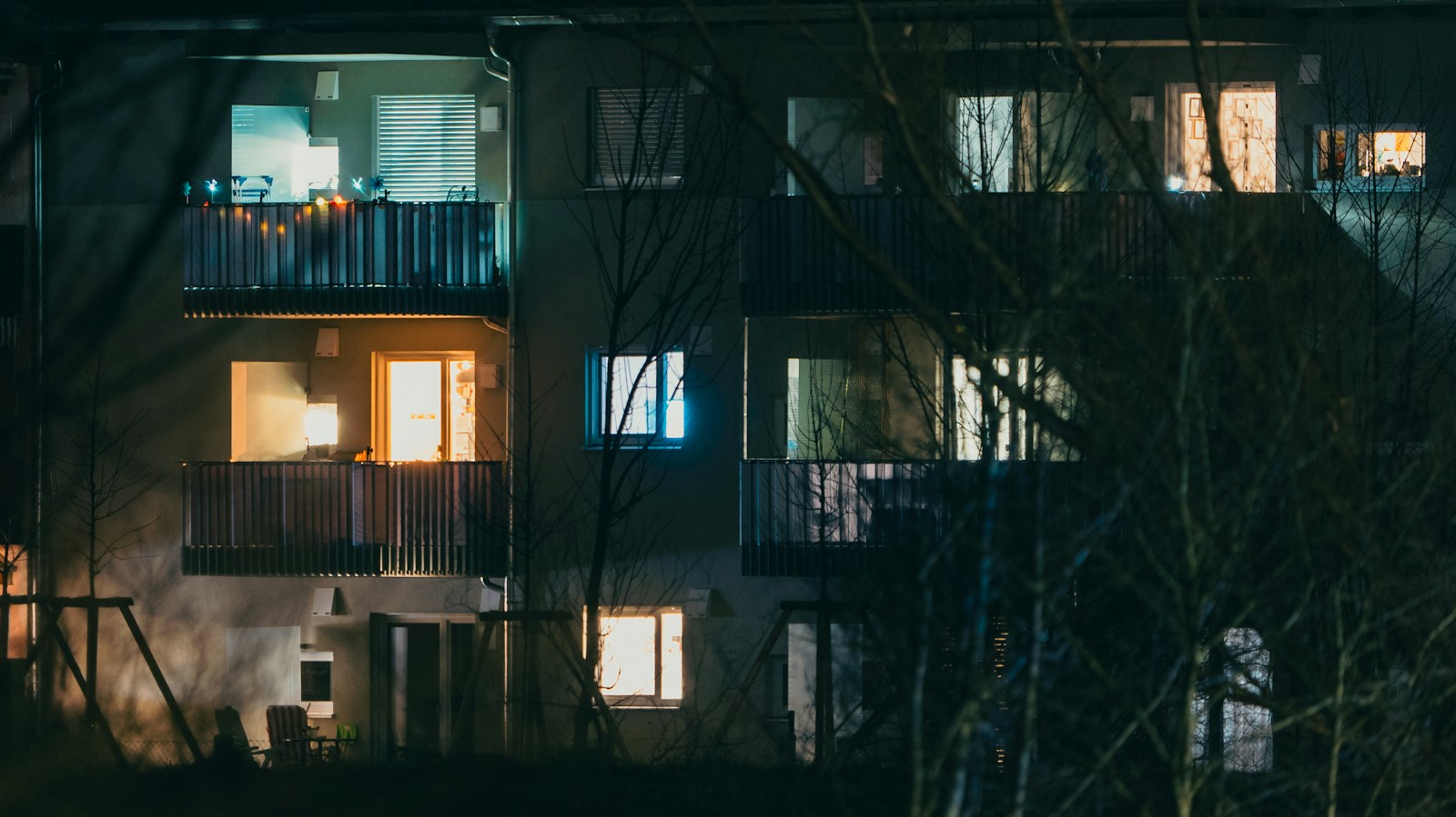 Lit apartment windows at night